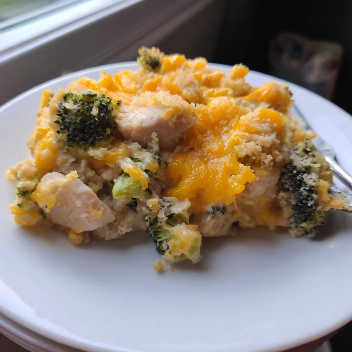 Creamy Chicken & Broccoli Cheddar Bake with golden cheese topping is a family favorite.  