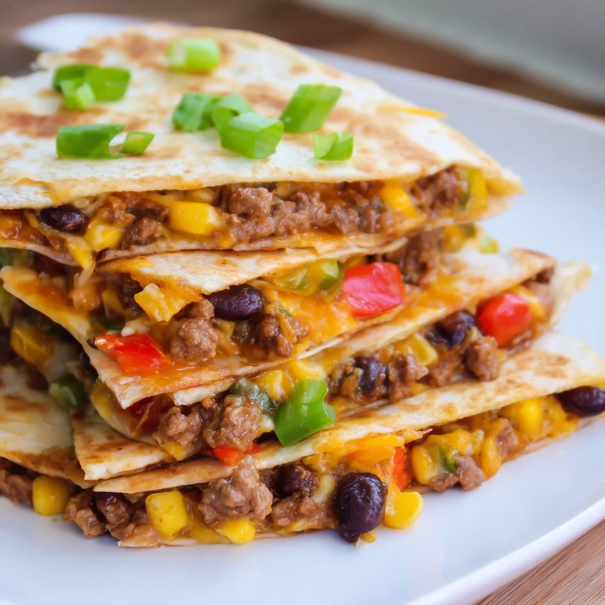 A sheet pan full of Sheet Pan Quesadillas with Beef, ready for a delicious family dinner.