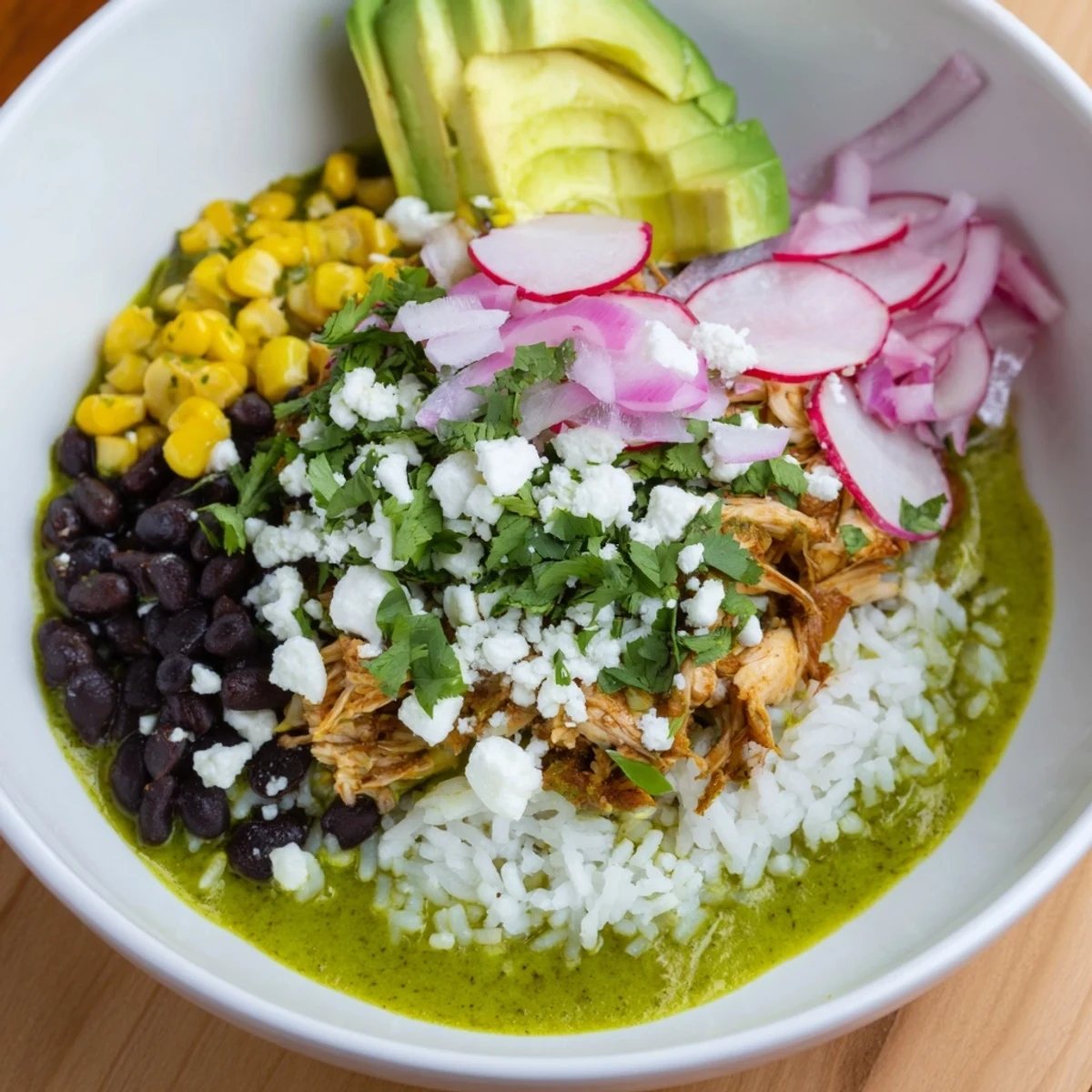 Bright, colorful Green Enchiladas Rice Bowl: a Tex-Mex delight with chicken, rice, and fresh cilantro.
