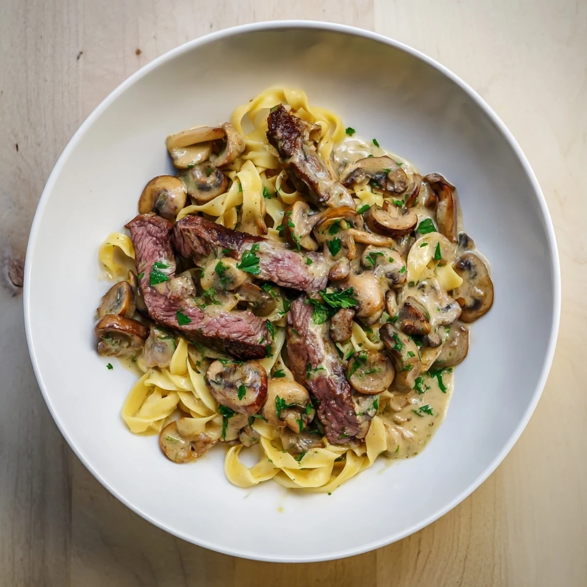 Delicious Creamy Mushroom Beef Stroganoff: savor tender beef strips swimming in a creamy mushroom sauce.