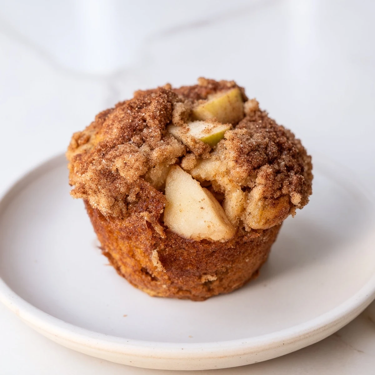 These moist Cinnamon Apple Muffins feature diced apples and a cinnamon sugar topping, perfect for brunch.