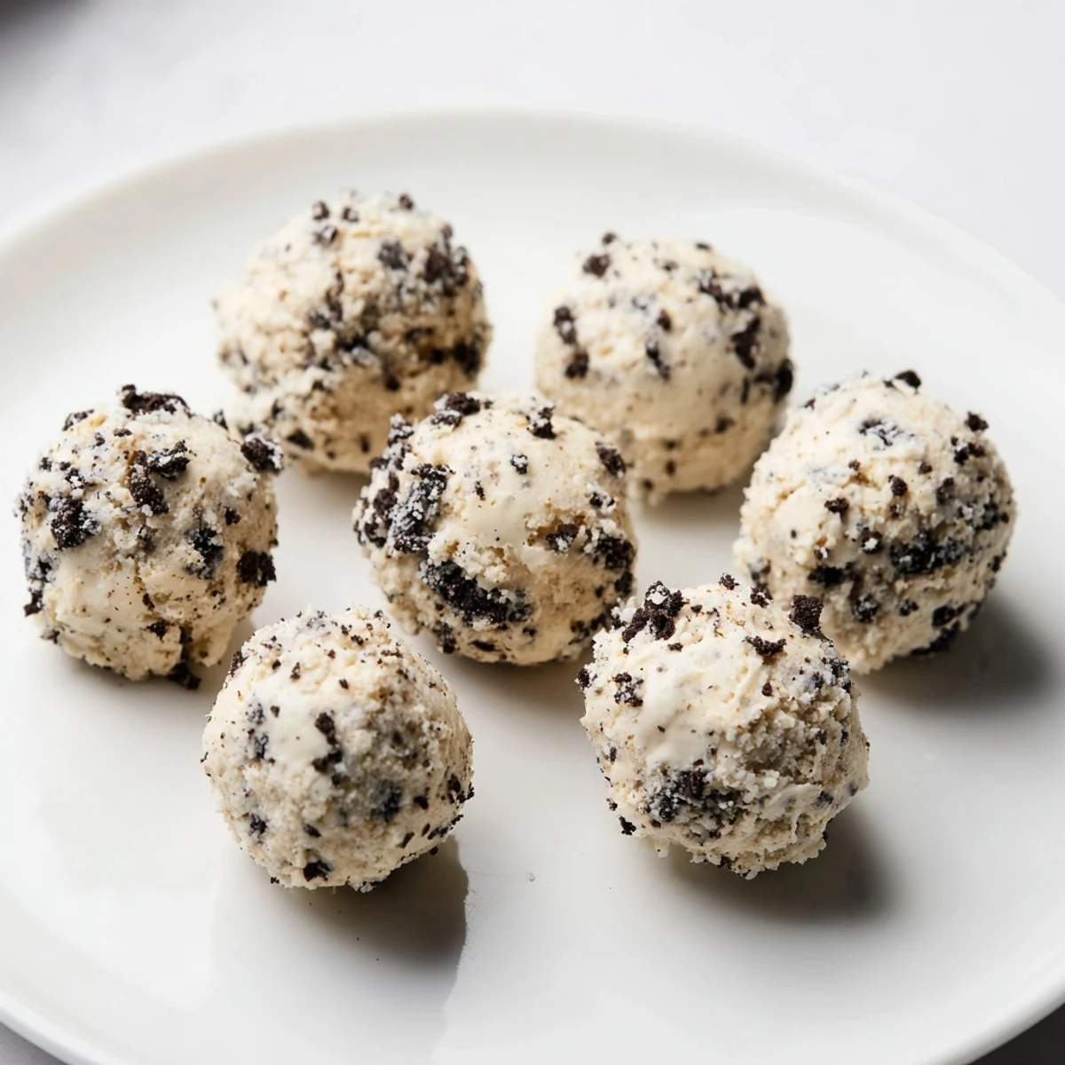 Cream Cheese Oreo Protein Balls ready to eat, showing the perfect texture and chocolatey coating.