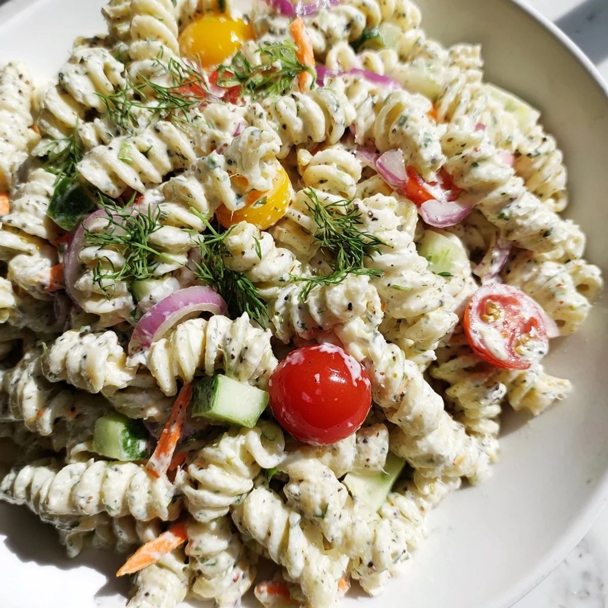 Vibrant Vegan Hemp Seed Ranch Pasta Salad, loaded with fresh veggies and creamy dressing, perfect picnic food.