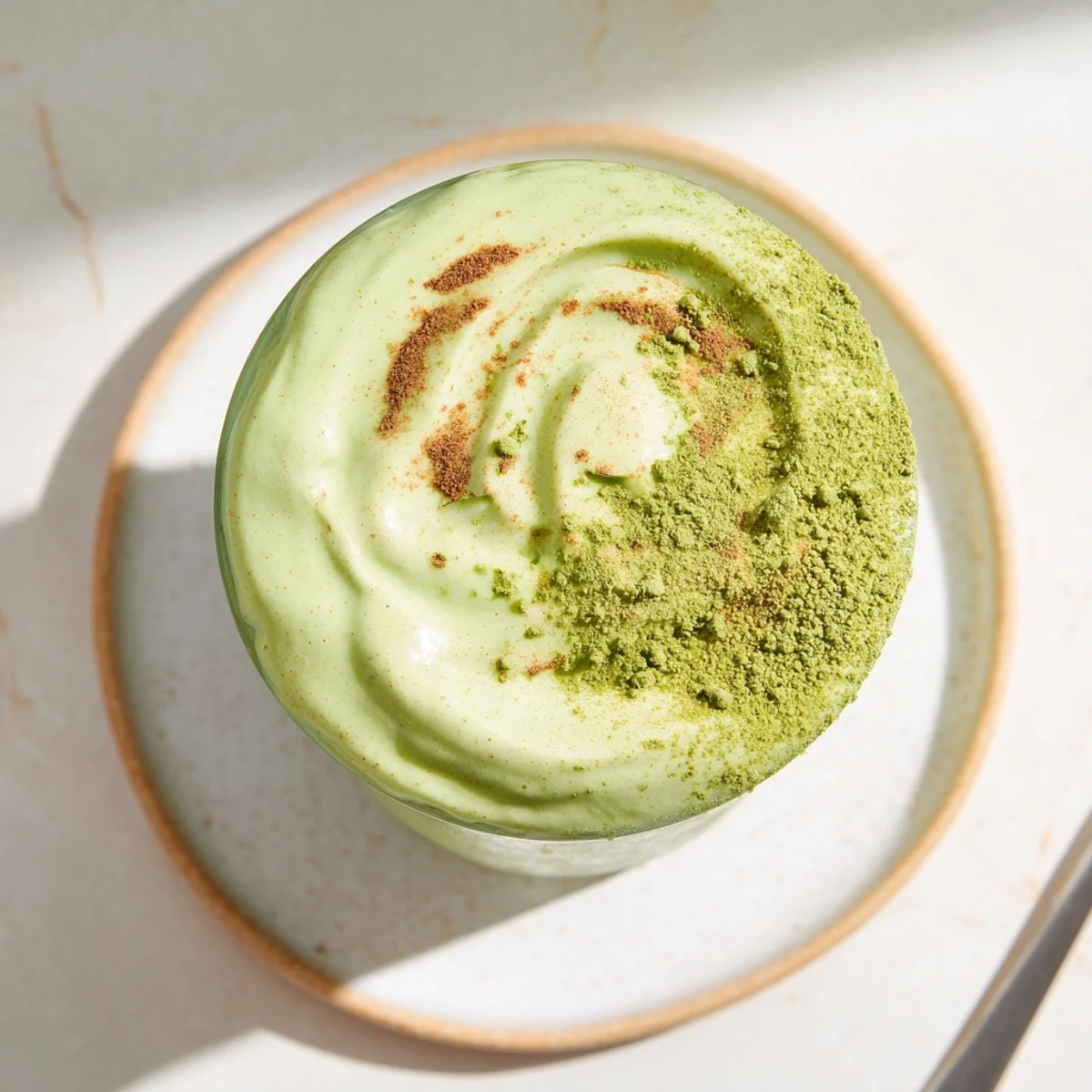 Creamy Matcha Snickerdoodle Protein Shake, a quick & easy breakfast, blended with frozen banana and almond butter.