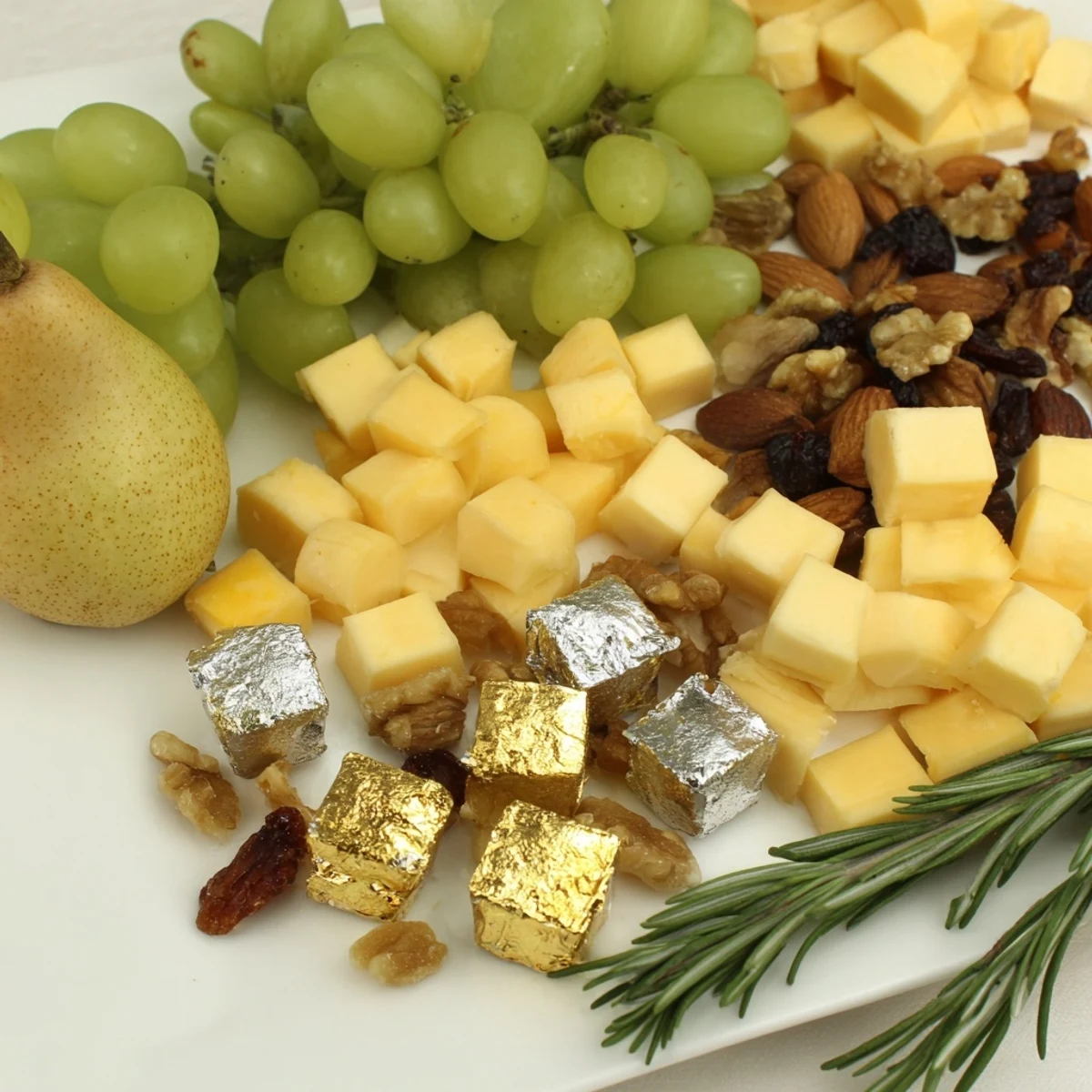 Gleaming Gold and Silver Cheese Cube Board: a beautiful array of festive cheeses, fruits, and nuts.