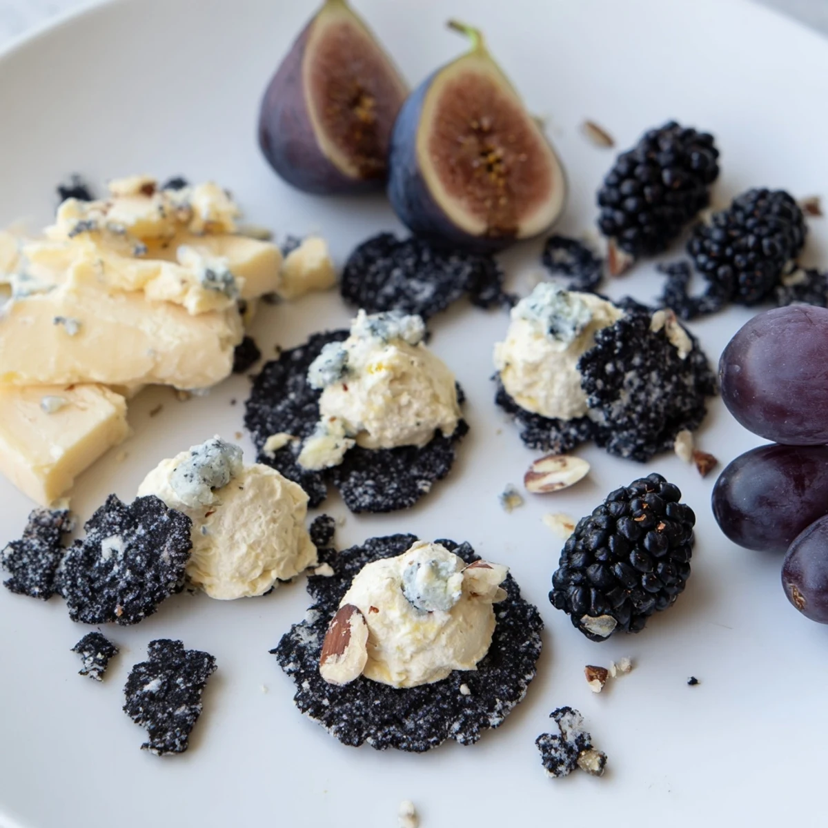 Deep Indigo Midnight Sky cheese board with blackberries, figs, and creamy cheeses for an elegant appetizer.
