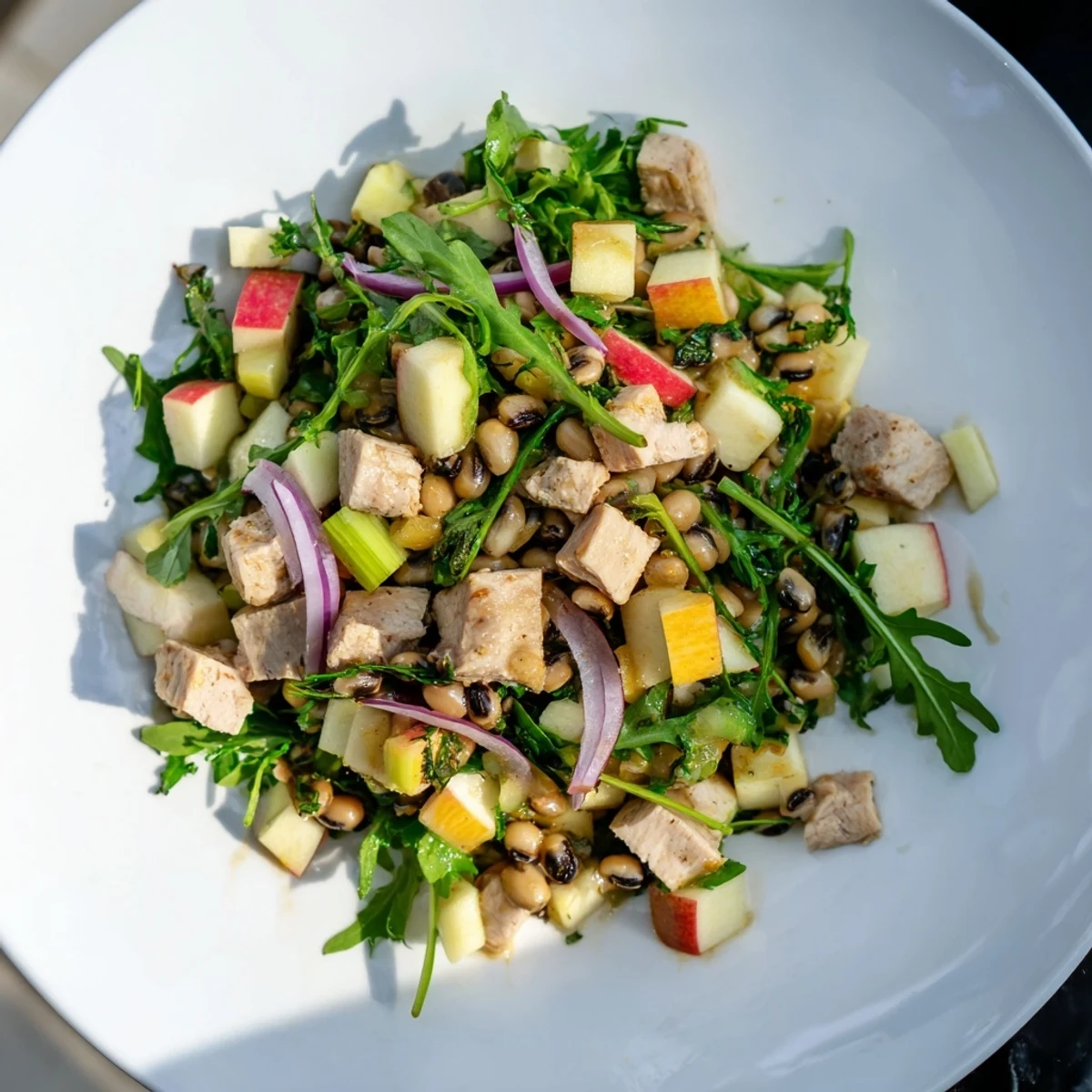 Chicken and Apple New Years Luck Salad, tossed in a tangy dressing, with crisp apples.