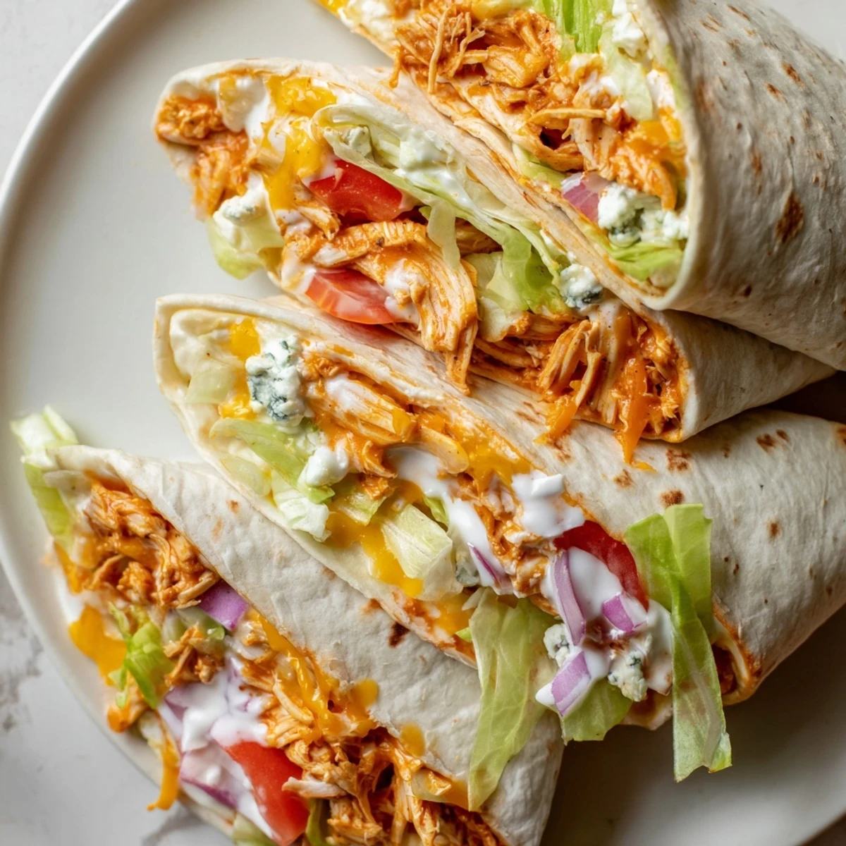 Folded and toasted, the Buffalo Chicken Wrap bursts with flavors of spicy chicken and fresh veggies.