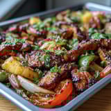 Juicy chicken fajitas with sweet pineapple and colorful bell peppers, roasted to perfection on a single sheet pan for easy cleanup.