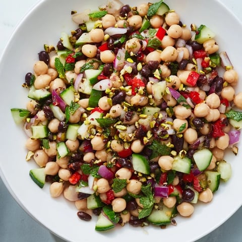 Vibrantly colorful Dense Bean Salad with Dubai Chocolate Notes, ready for a delicious, healthy meal.