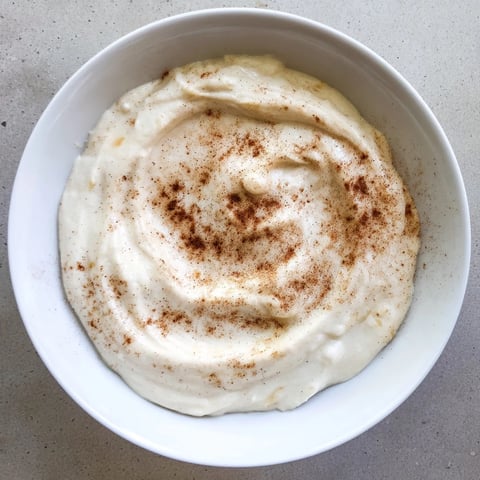 Creamy Greek Yogurt Fruit Dip, ready to be scooped up with fresh fruit on a serving platter.
