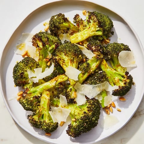 Golden-brown charred broccoli salad with Parmesan, a flavorful vegetarian side dish.