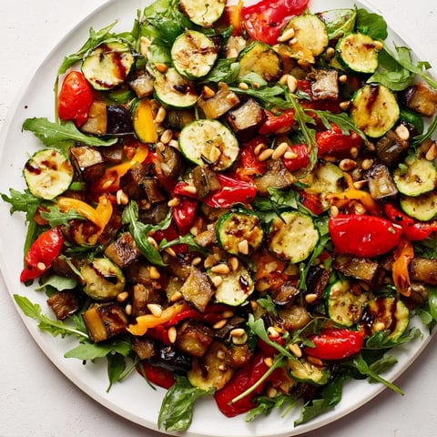 Warm and colorful Roasted Vegetable Salad with tender vegetables and tangy balsamic dressing.