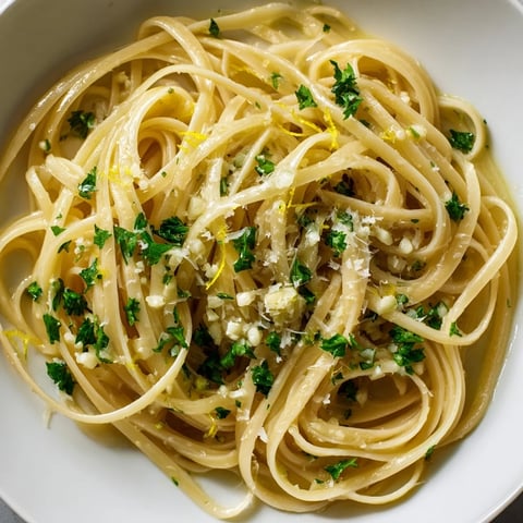 Golden garlic butter linguine, glistening with parsley, ready to twirl onto your fork.
