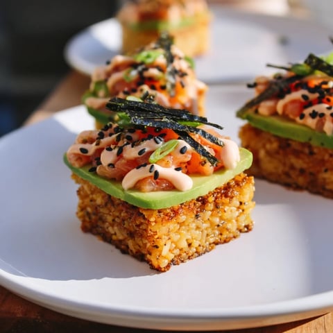 Golden, crispy rice topped with savory salmon; this Crispy Rice Salmon Stack is a flavorful bite.