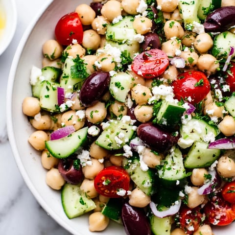 Imagine the colorful Mediterranean Chickpea Salad: bright red tomatoes, creamy feta, and zesty lemon dressing.
