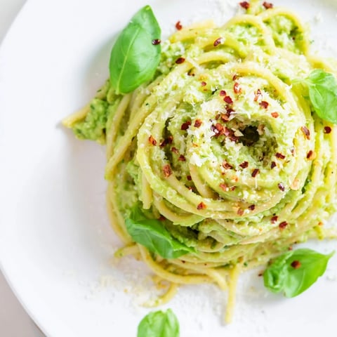 A vibrant bowl of Smashed Avocado Pasta, tossed with fresh herbs and a squeeze of lime.
