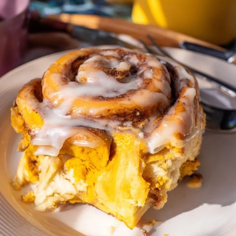 Warm, spiced Thanksgiving Sweet Potato Cinnamon Roll Dessert rolled with sweet potato and cinnamon.  