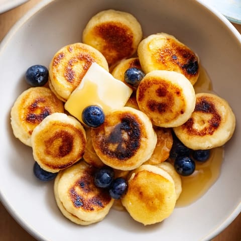 A bowl of delicious Pancake Cereal, perfect with fresh berries, cooked quickly on the griddle.