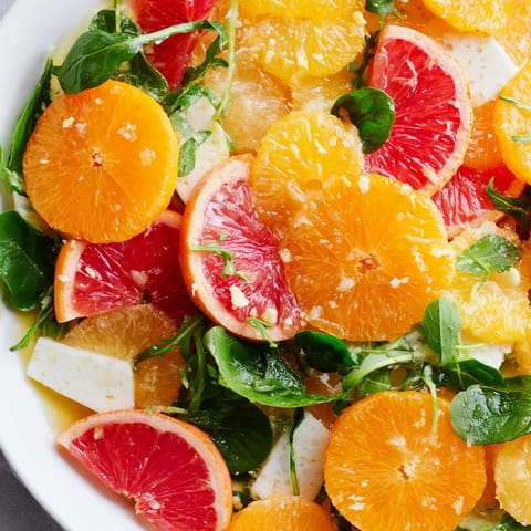 Fresh, vibrant Winter Citrus & Candied Pecan Salad featuring glistening citrus segments and crunchy pecans.