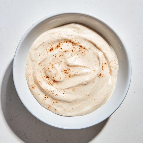 A visually inviting photo of Greek Yogurt Fruit Dip, perfect as a snack with juicy red strawberries.