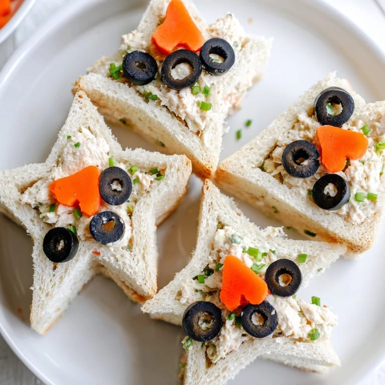 Freshly assembled Mini Starfish Sandwiches shaped like stars, perfect for a kids' party, ready to enjoy.