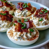 Bacon Ranch Deviled Eggs with crispy bacon and fresh chives, perfect for Easter brunch or any party.